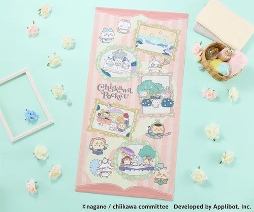 アリスなバスタオル。ピンクのストライプ地に額縁風のイラストが配置されている